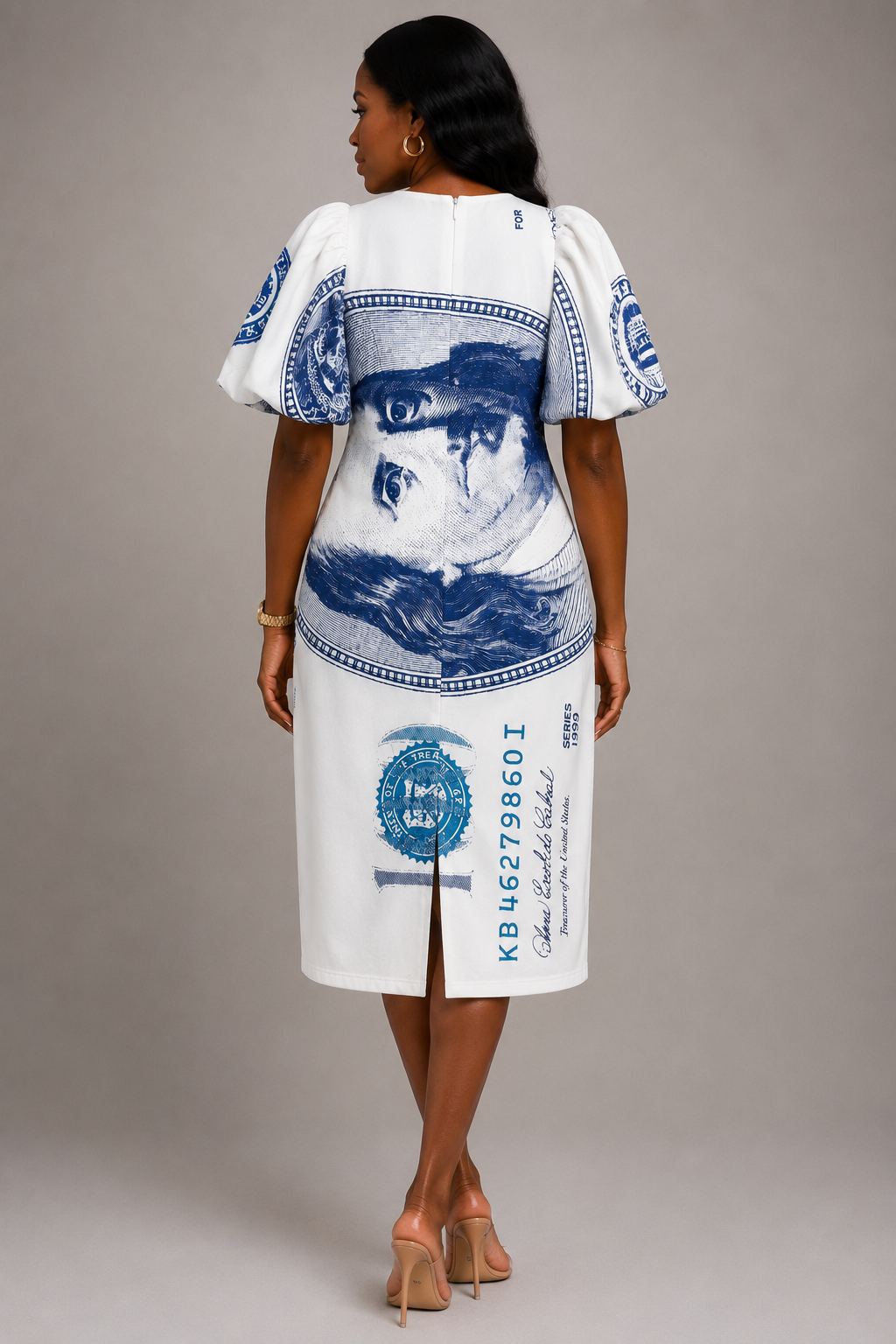 Model wearing dollar print scuba midi dress with bold puff sleeves in a trendy fashion look.