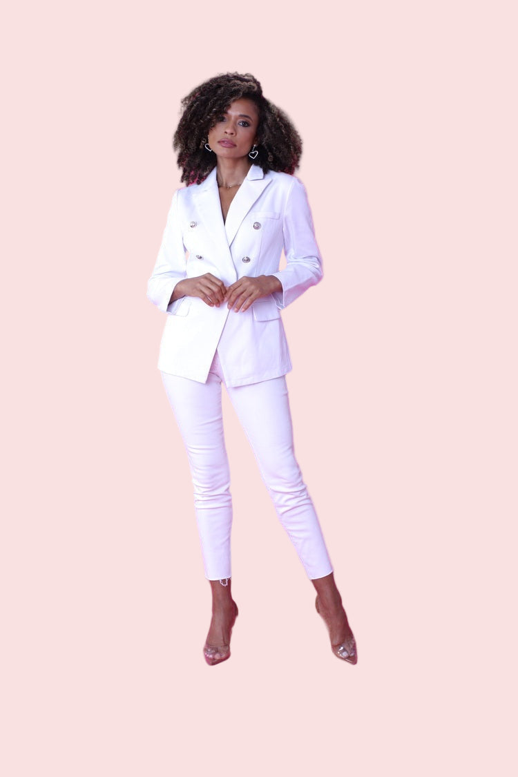 White double-breasted blazer shown from the front in a full-length standing pose, highlighting the structured silhouette and classic lapels by For Her NYC