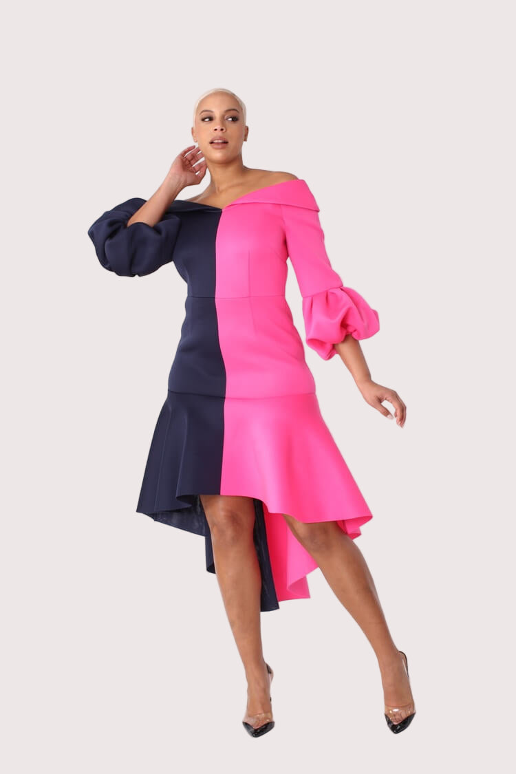 Colorblock dramatic flounce sleeve midi dress front view with model walking to show movement and silhouette by For Her NYC