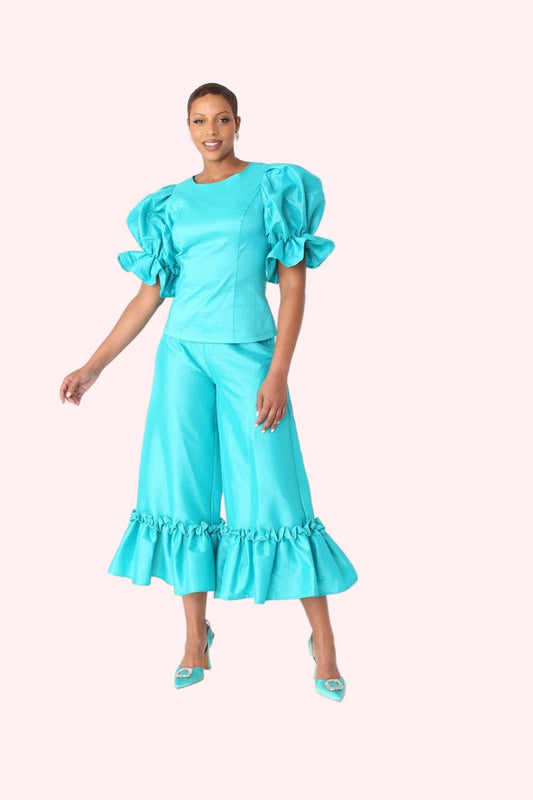 Model wearing jade dramatic ruffle hem wide leg pants standing front-facing, showcasing full silhouette and ruffle detail by For Her NYC