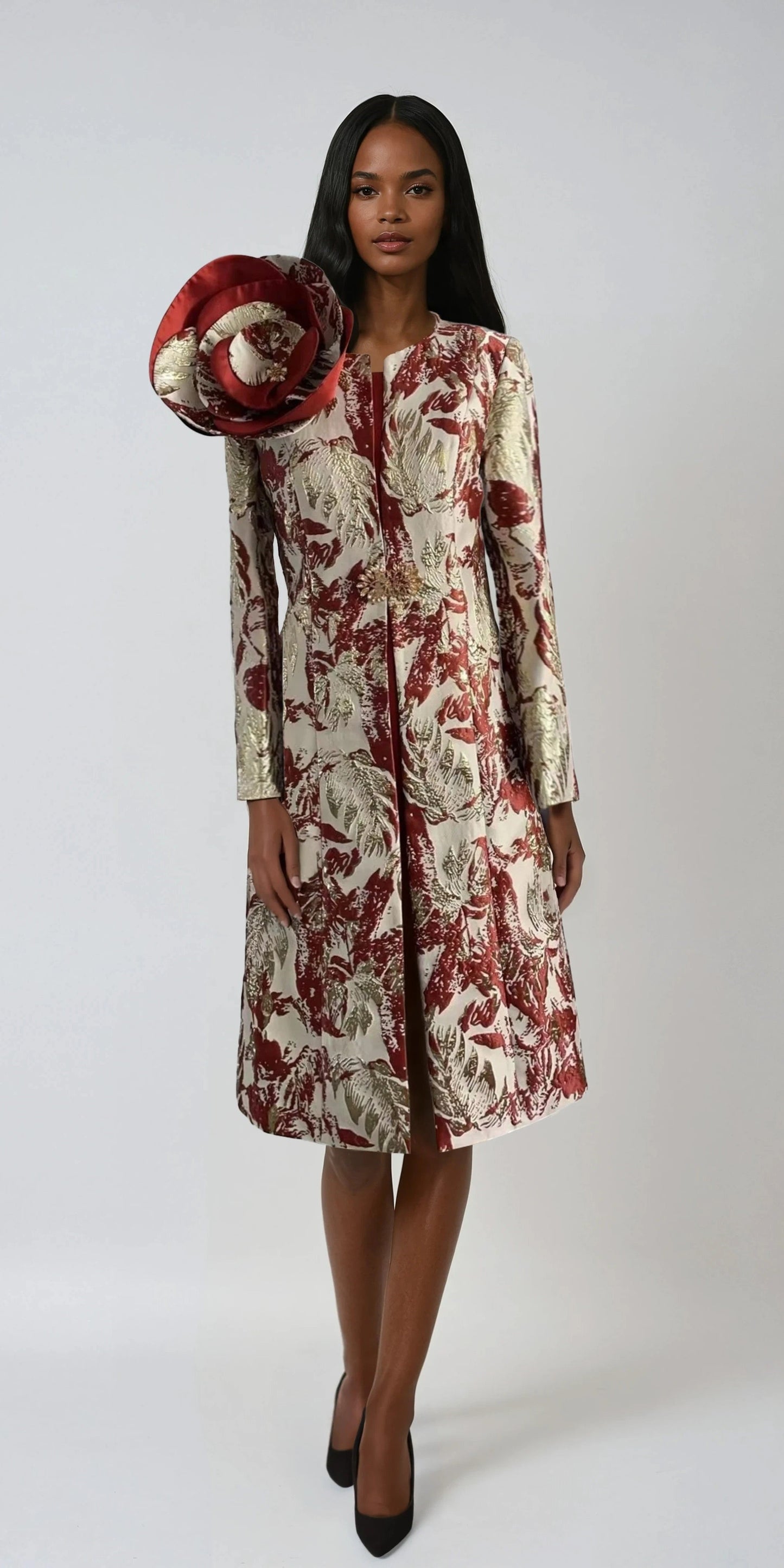 Model wearing the coral and gold multi elegant brocade dress with matching jacket standing front facing, highlighting luxurious brocade fabric and refined occasion silhouette by Tally Taylor