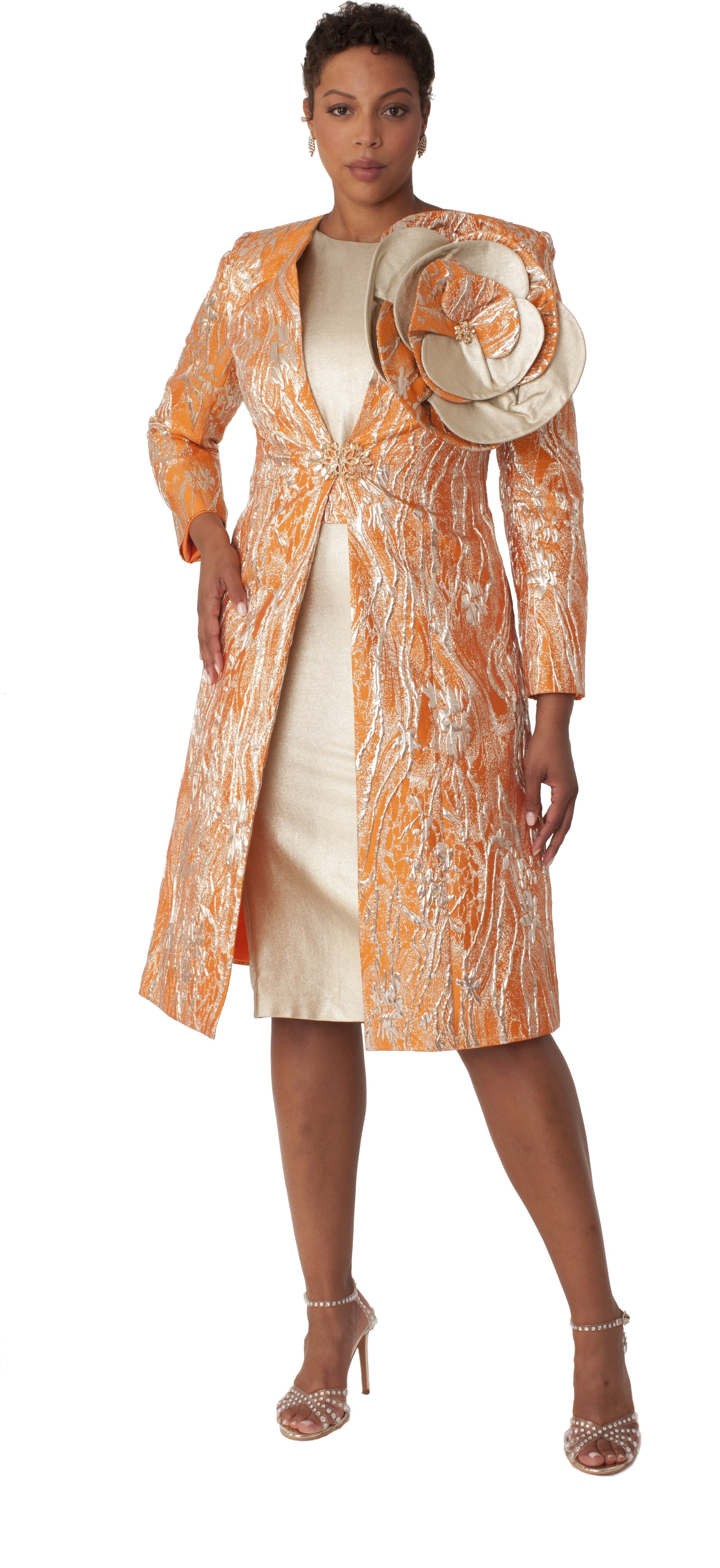 Model wearing the orange and gold elegant brocade dress with matching jacket standing front facing, showcasing rich color, detailed brocade texture, and polished churchwear style by Tally Taylor