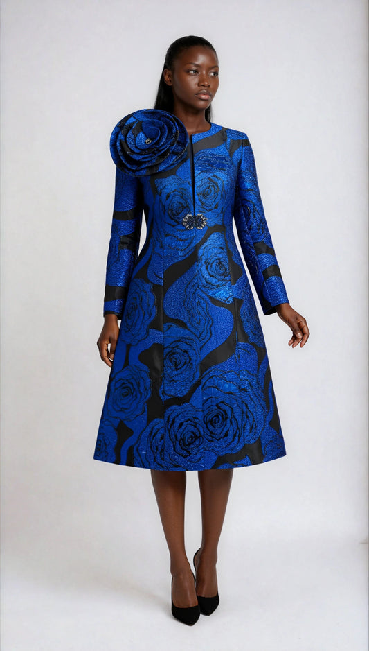 Model wearing the royal and black elegant brocade dress with matching jacket standing front facing, showcasing ornate brocade pattern, structured silhouette, and formal churchwear elegance by Tally Taylor