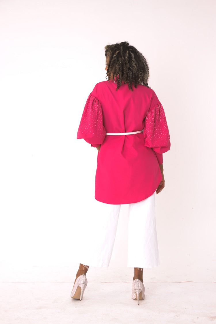 Back view of the fuchsia embellished long sleeve rhinestone shirt styled with pants – For Her NYC