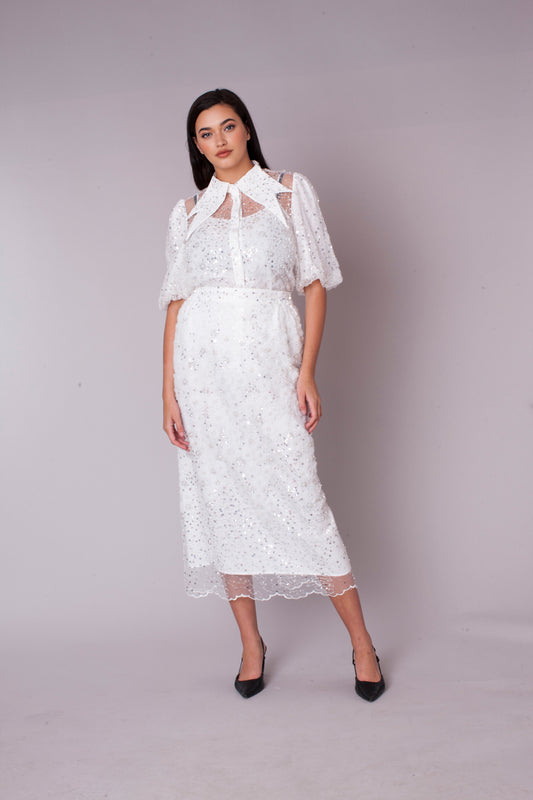 White embroidered sequin organza skirt set with floral detailing, model standing front view, For Her NYC
