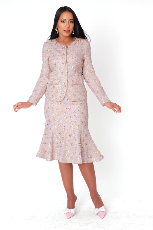 Model wearing the blush embroidered sequin tweed jacket and skirt set standing front facing, showcasing tailored jacket, flared skirt, and subtle sparkle details by Tally Taylor