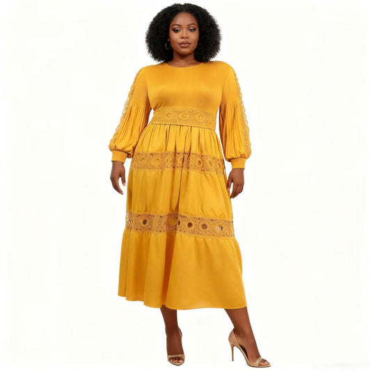 Front view of model wearing a yellow long sleeve tiered midi dress with lace inset detailing and flowing skirt, For Her NYC