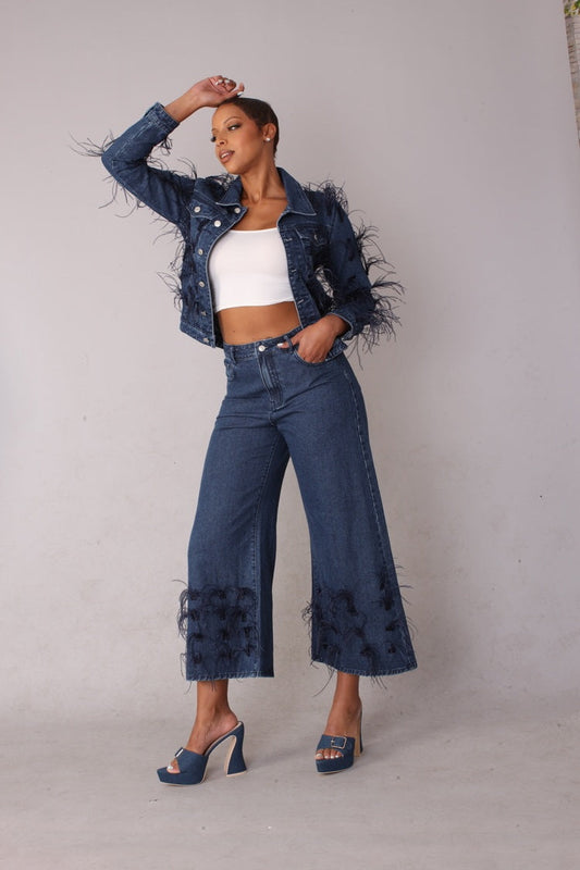 Blue denim wide leg jeans with feather trim shown front standing pose styled with cropped jacket, For Her NYC