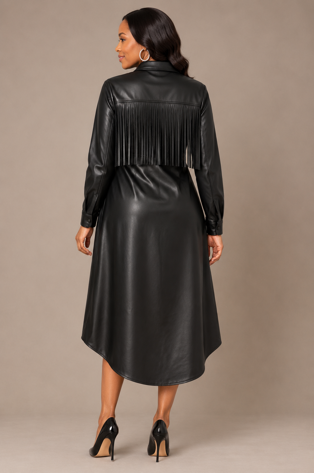 Back view of the For Her NYC High-Low Shirt Dress featuring a black high-low silhouette with fringe detailing across the upper back, style S0278.