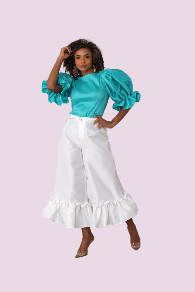 Jade puff sleeve satin blouse front full body with white skirt and soft background — For Her NYC