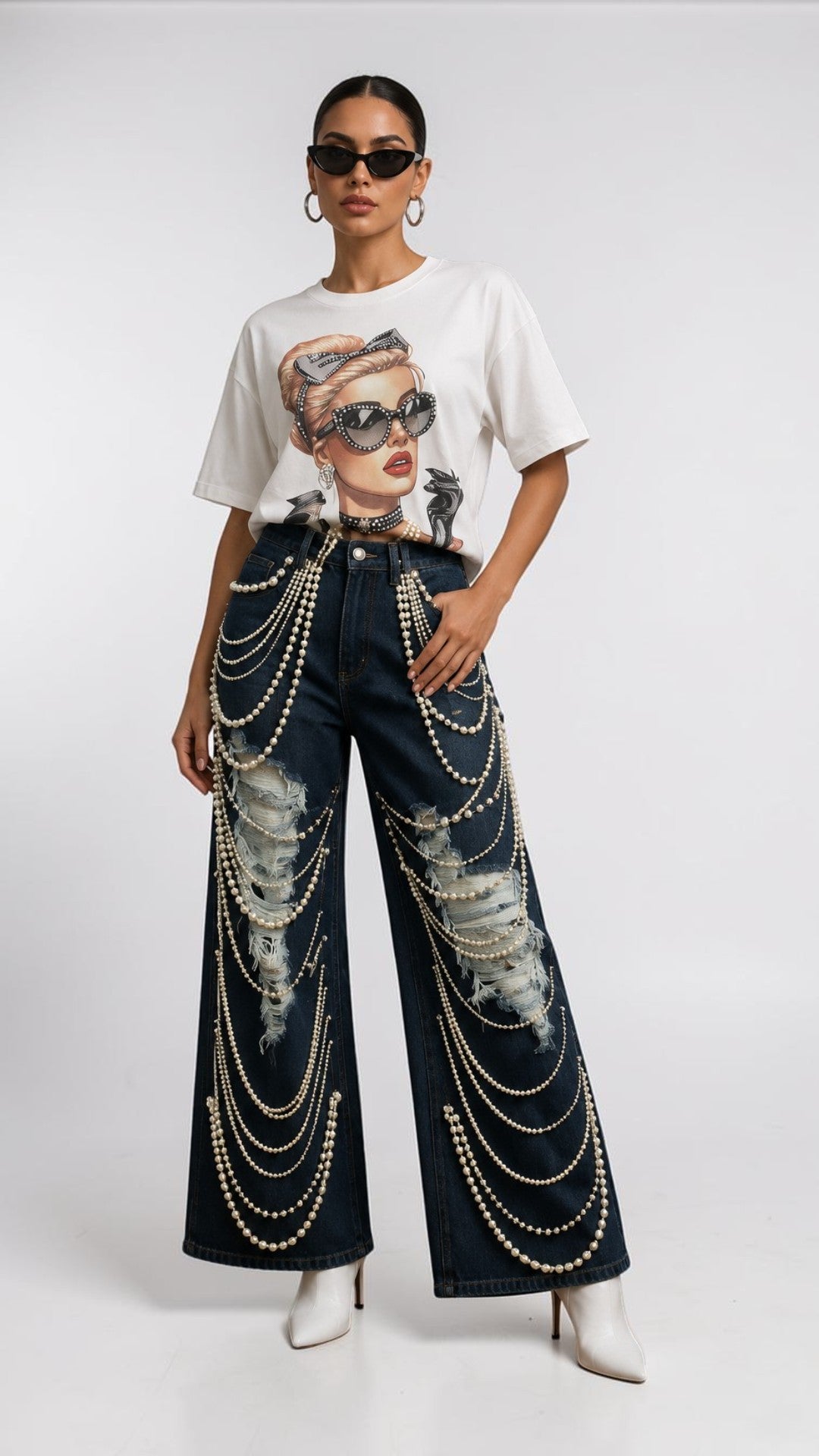 Front view of a model wearing the dark-wash For Her NYC Pearl Wide-Leg Denim Pants - 82776 with distressed details and draped pearl embellishments