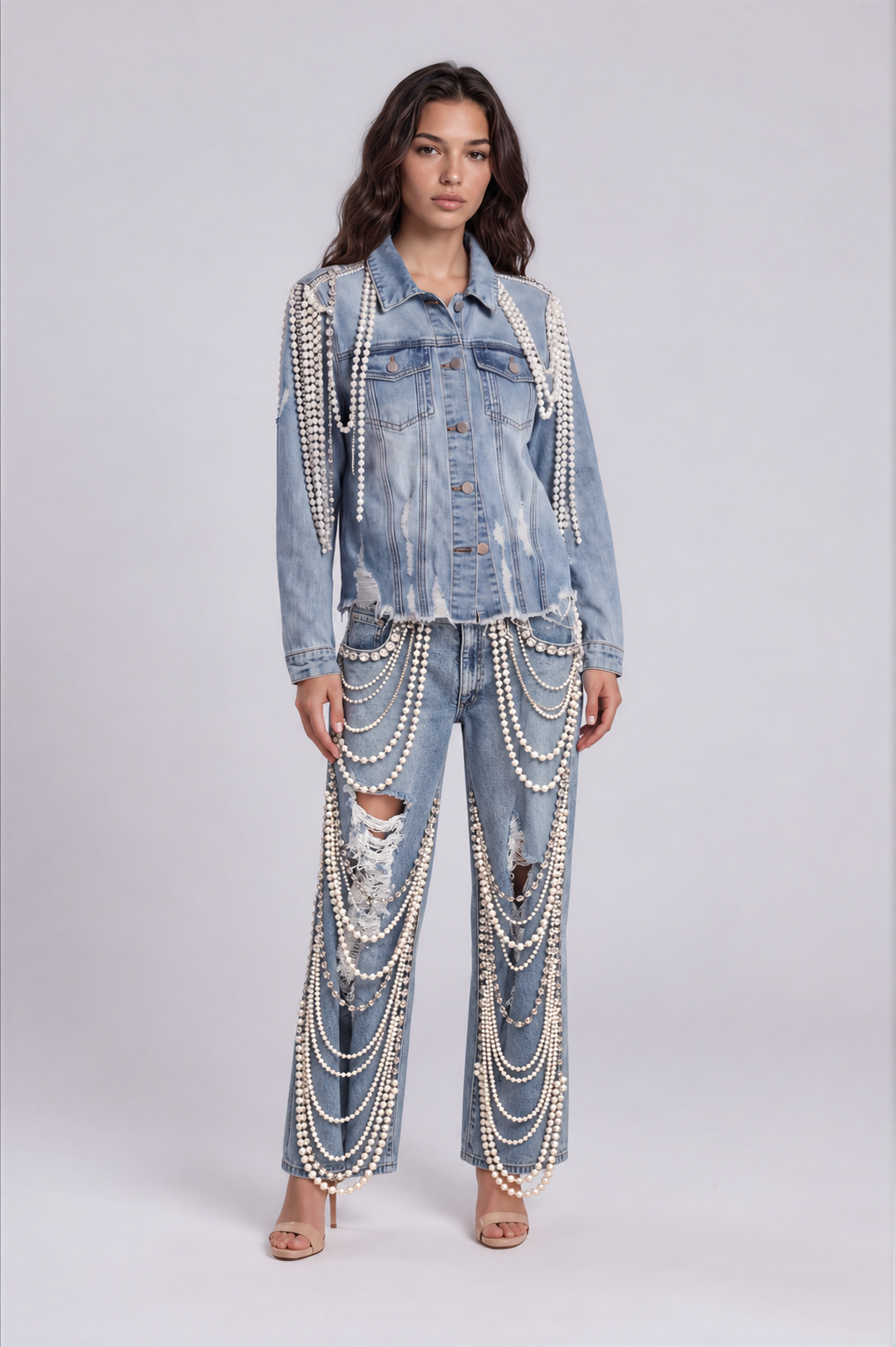 Front view of a model wearing the denim-color For Her NYC Pearl Wide-Leg Denim Pants - 82776 with distressed details and cascading pearl embellishments