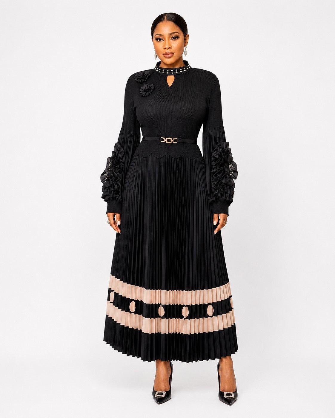 Front view of a model wearing the black For Her NYC Statement Sleeve Midi Dress - 83467 with floral ruffle sleeves, an embellished keyhole neckline, belted waist, and pleated skirt with beige geometric trim