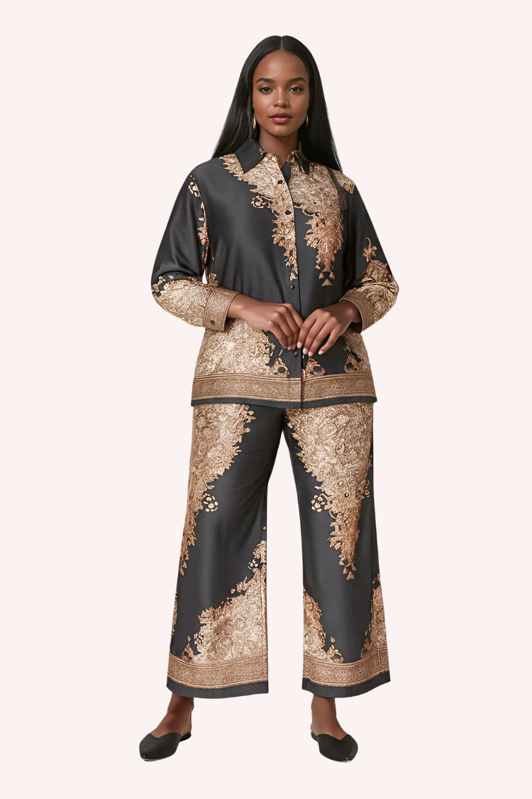 Full view of navy baroque print satin pant set styled with heels by For Her NYC.