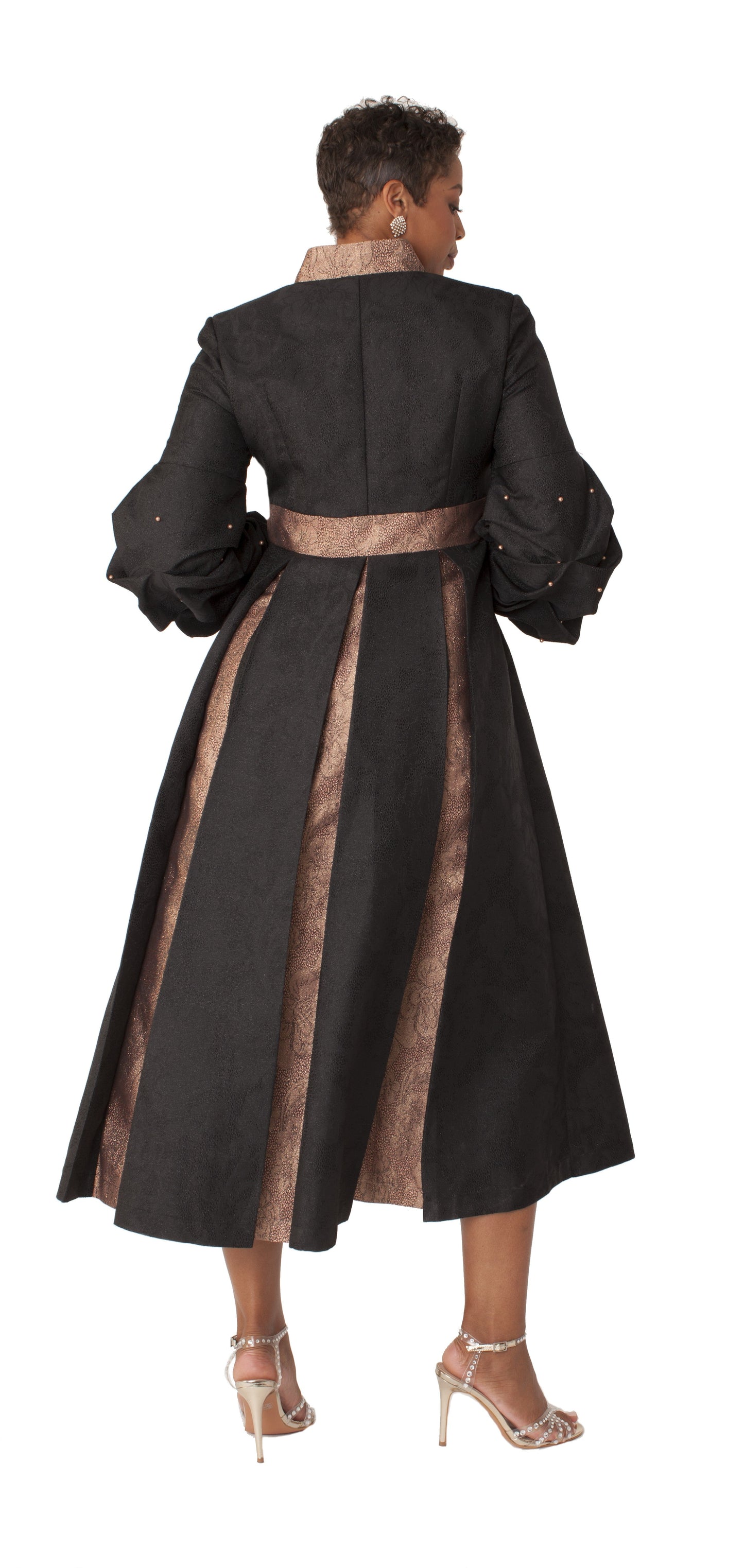 Black formal dress robe with puff sleeves and pearl cross accent, back view highlighting flowing length and structured design by Tally Taylor