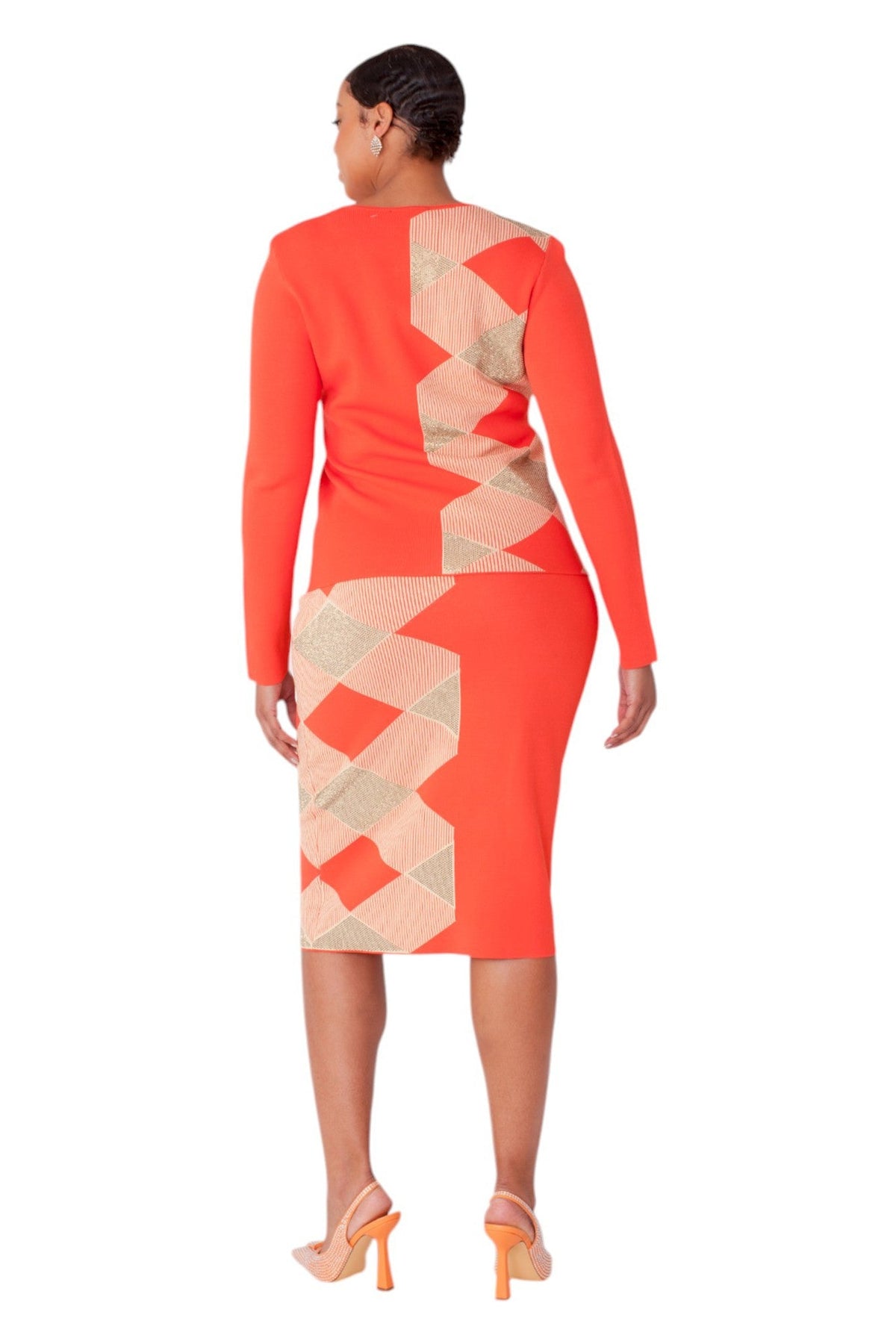 Back view of orange and gold geometric knit two-piece set with a sleek fitted silhouette and midi skirt by Tally Taylor