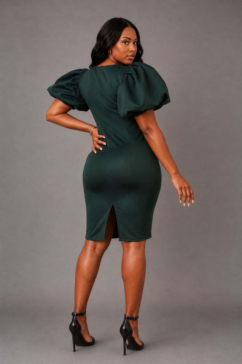 Model wearing hunter green scuba puff sleeve midi dress with a figure flattering silhouette.