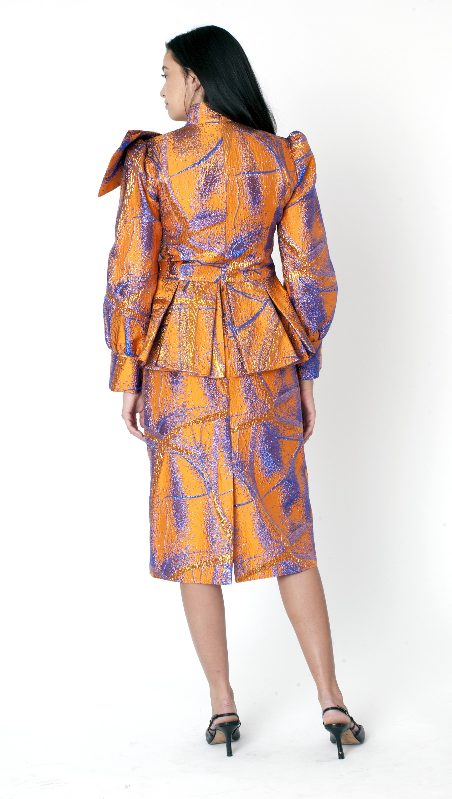 Orange and navy metallic abstract peplum jacket and pencil skirt suit back view with structured silhouette – Tally Taylor
