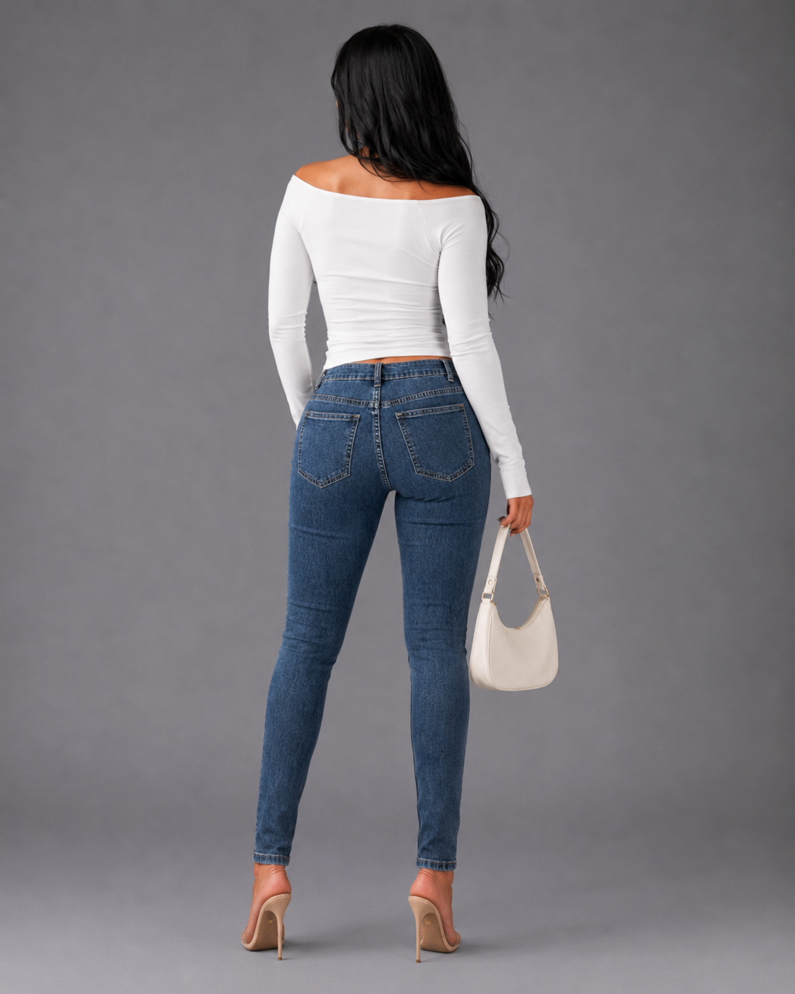 Back view of model wearing the denim metallic fringe cropped jeans showing slim fit silhouette and fringe placement throughout by For Her NYC