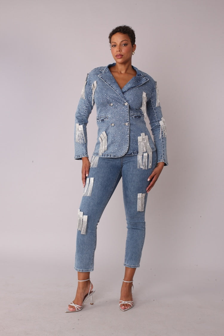 Front view of model wearing the denim metallic fringe cropped jeans highlighting ankle length cut and embellished chain fringe accents by For Her NYC