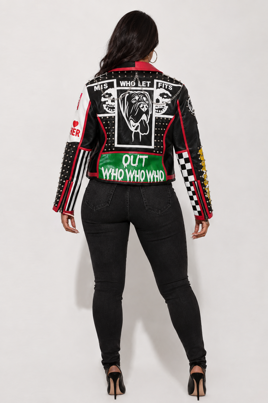 Model wearing black and red moto faux leather jacket, back view highlighting graphic paneling and urban moto-inspired design by For Her NYC