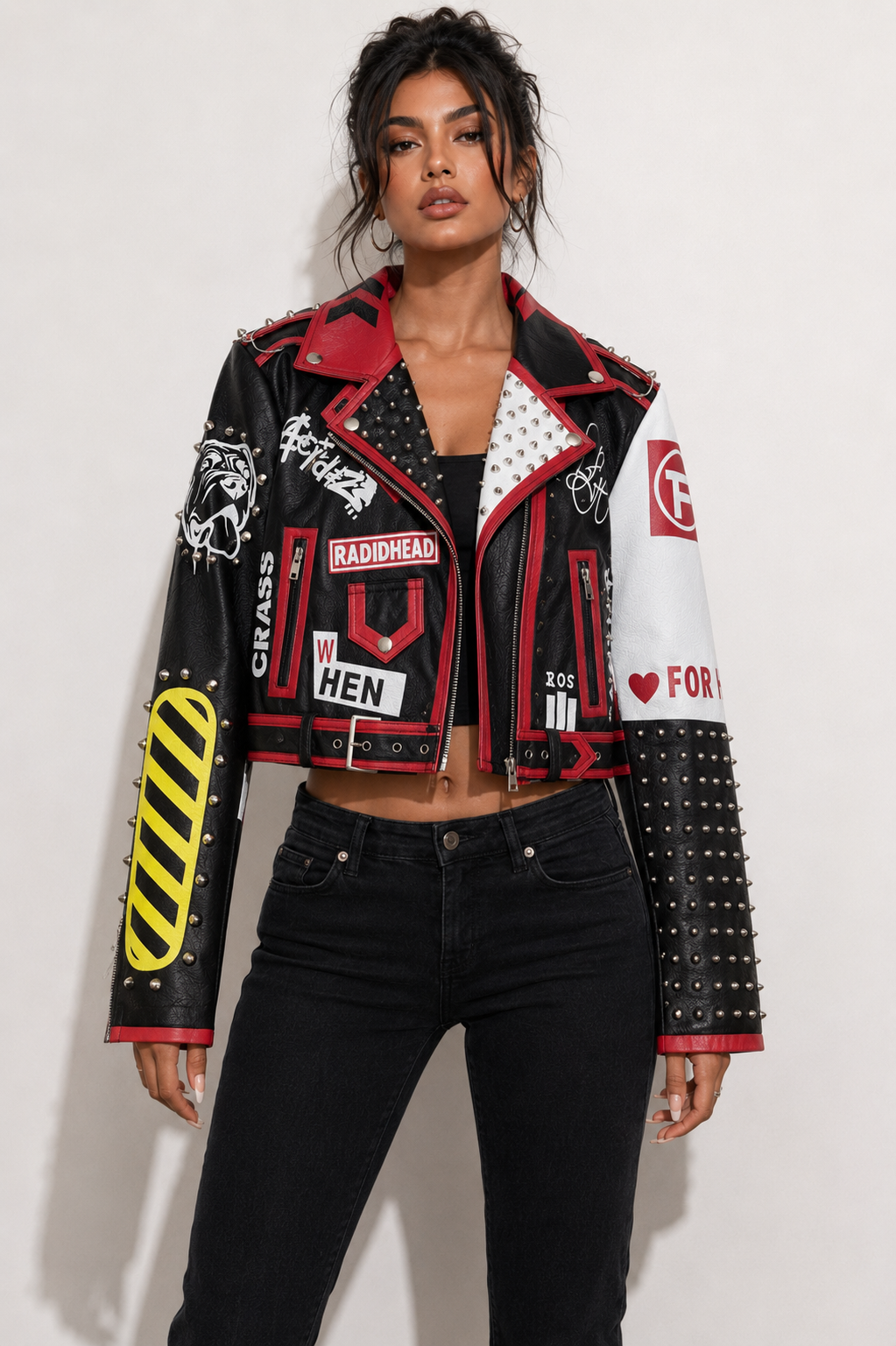Model wearing black and red moto faux leather jacket, front view highlighting graphic paneling and urban moto-inspired design by For Her NYC