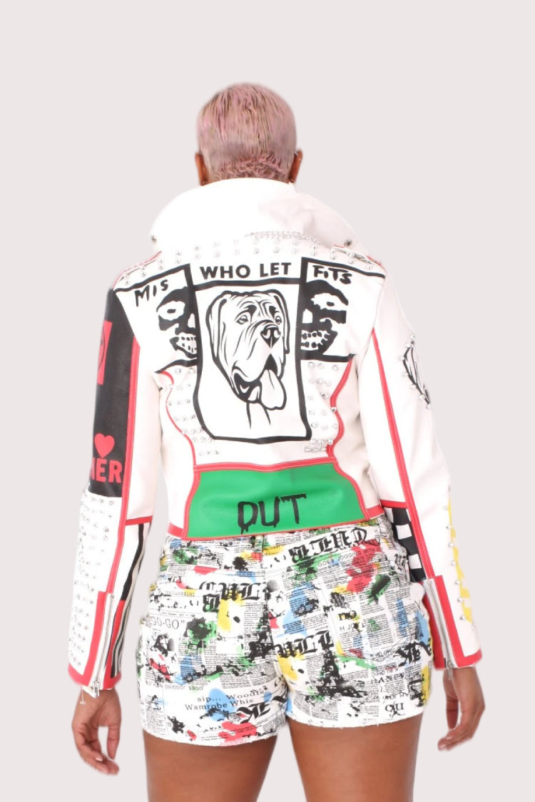 Model wearing white and red moto faux leather jacket, back view showcasing graphic back design and structured moto shape by For Her NYC
