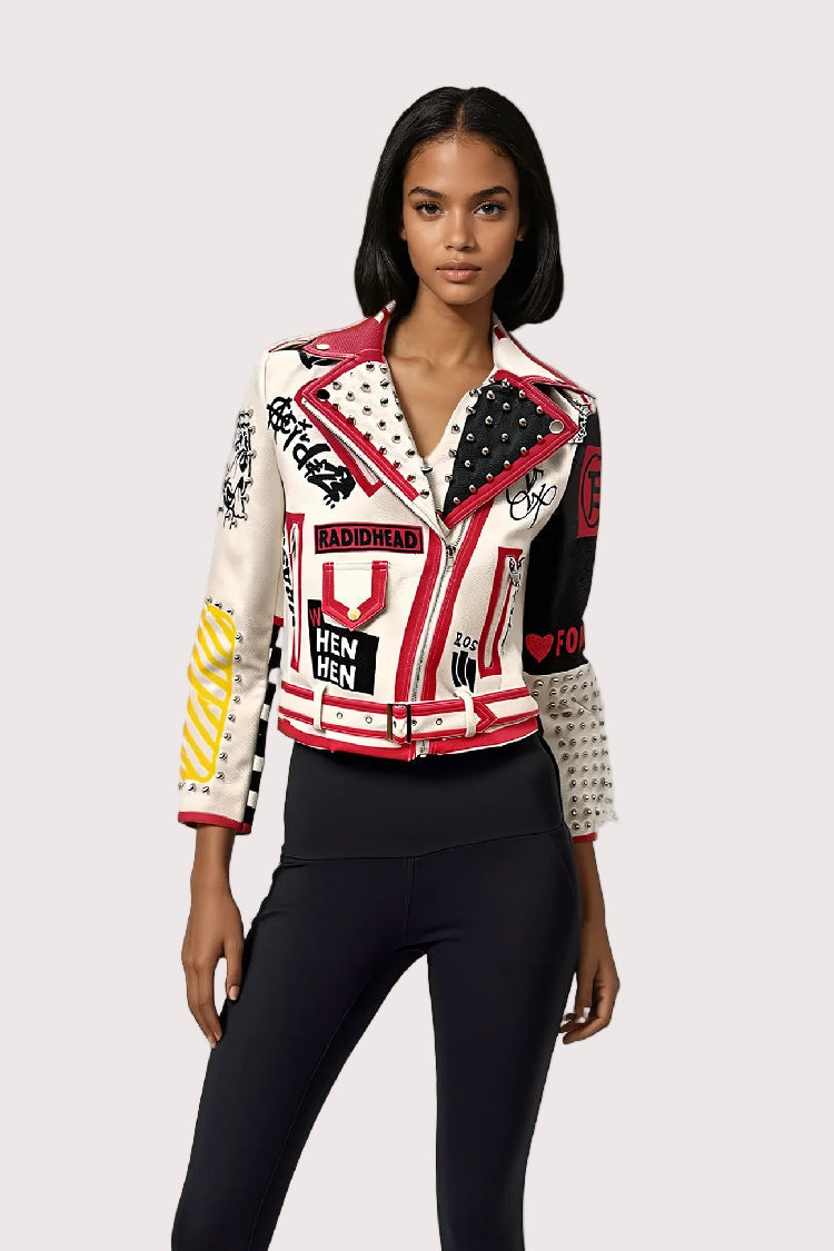 Model wearing white and red moto faux leather jacket, front-facing hero pose highlighting bold graphic print and fitted moto silhouette by For Her NYC