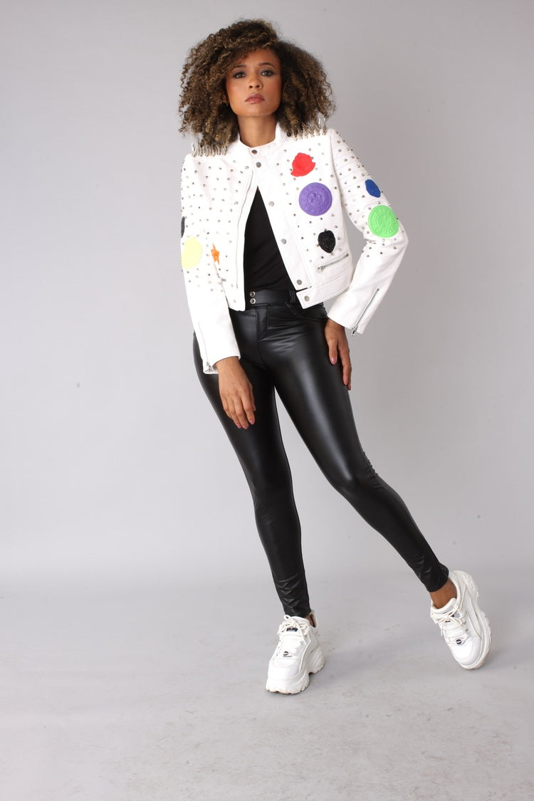 White multi-colored studded leather moto jacket front view styled with black leggings – For Her NYC