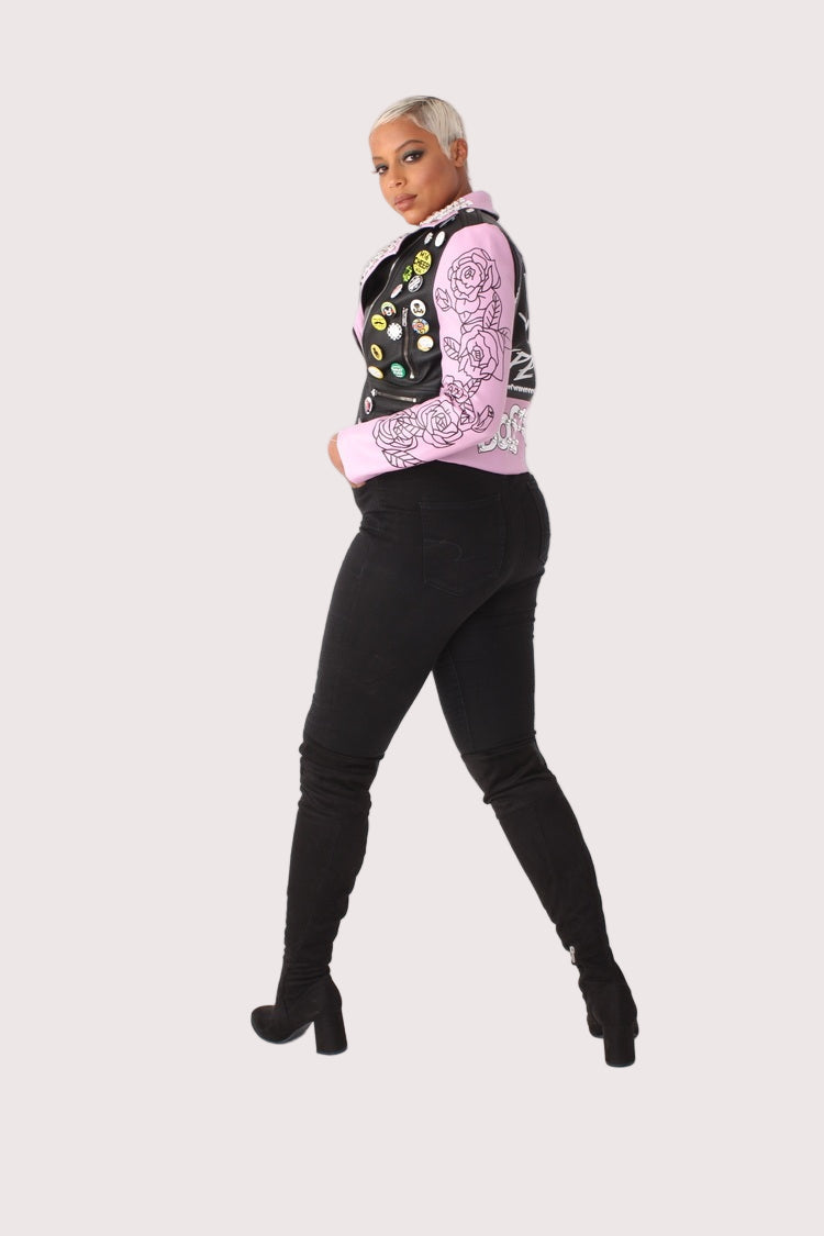 Model wearing LILAC /BLACK faux leather jacket with pins and studs, side angle pose highlighting moto zipper, studded details, and tailored fit by For Her NYC