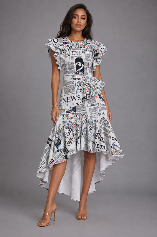 White newspaper print ruffle midi dress on model facing forward