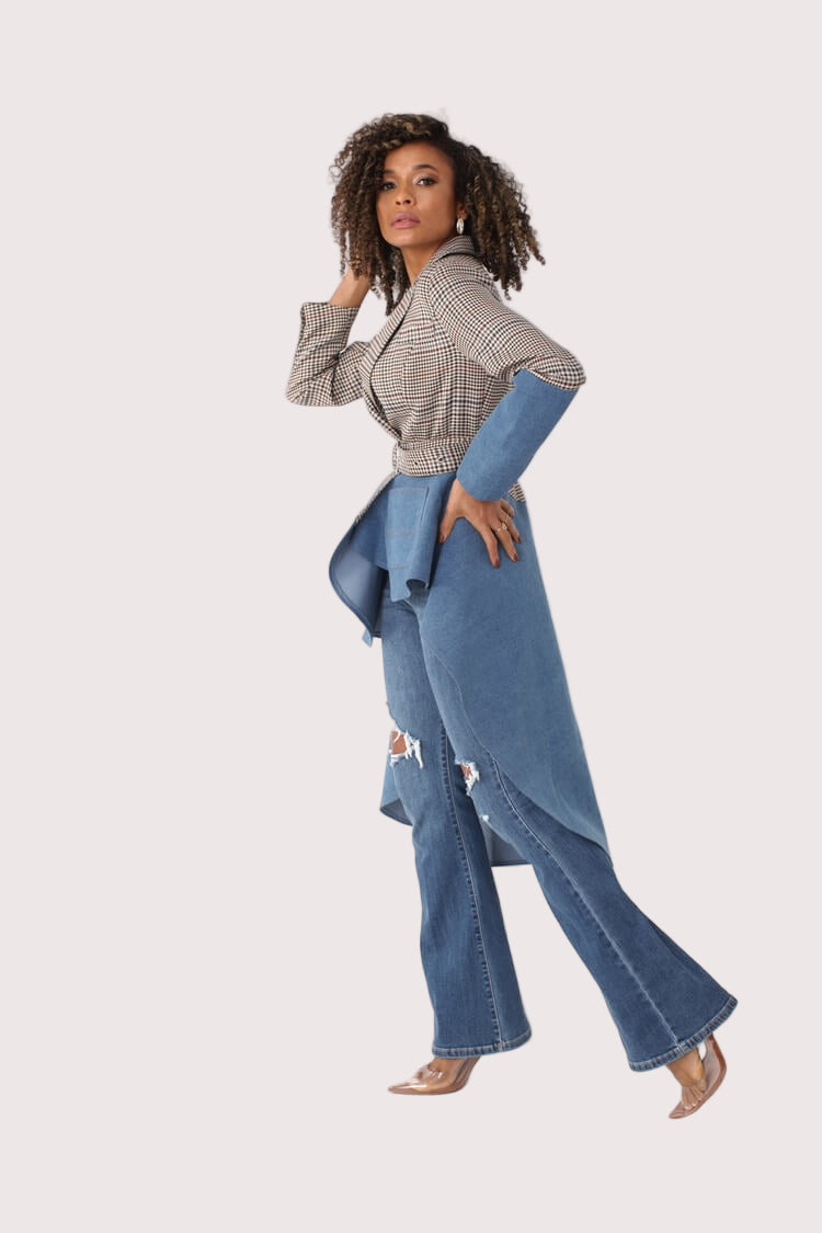 Side view of PLAID/DENIM high-low blazer with hand on hip, paired with distressed flare jeans – For Her NYC