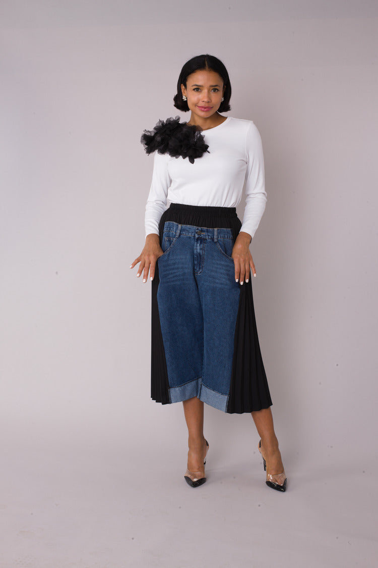 Model wearing Pleated Panel Denim Culottes in front standing pose showing pleated panels and cropped wide-leg silhouette, For Her NYC