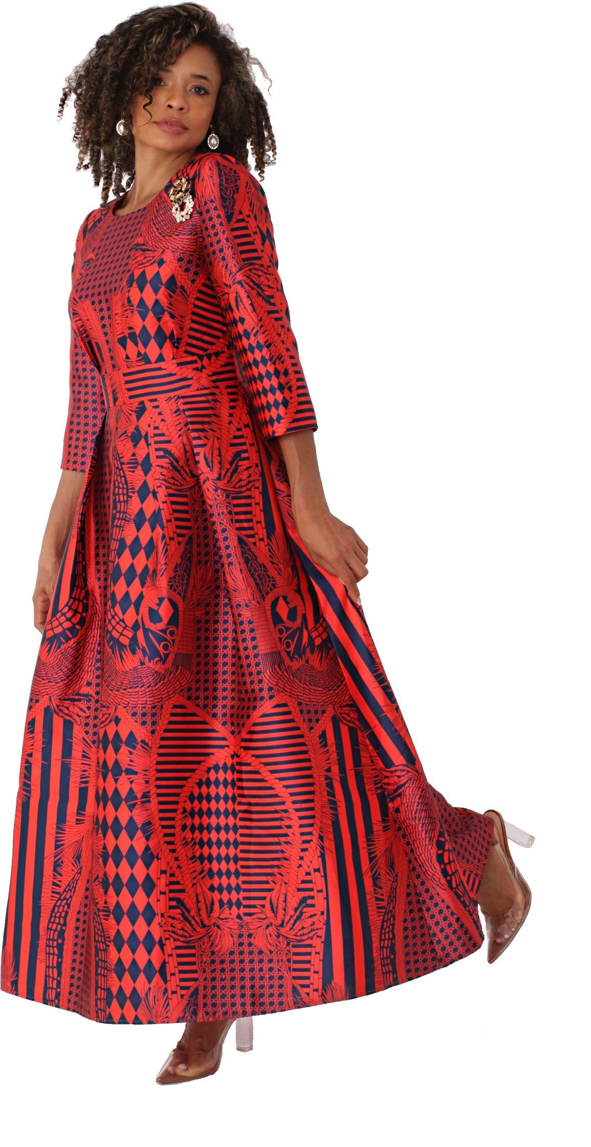 Model wearing fire red and navy plus size satin dress with rhinestone brooch, front standing pose by Tally Taylor