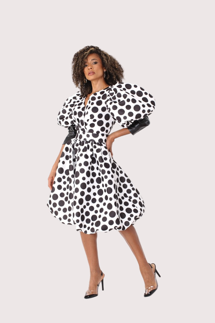Right angled view of polka dot puff sleeve midi dress — For Her NYC.