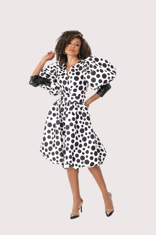 Front view of black and white polka dot midi dress with puff sleeves — For Her NYC.