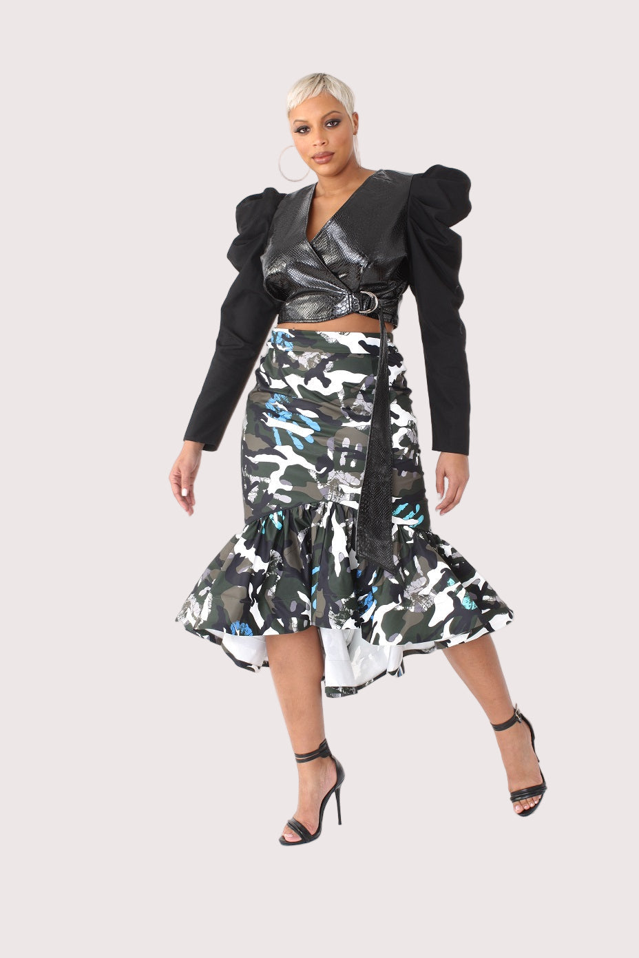Grey olive camo high low skirt front pose with asymmetrical hem and statement bold print.