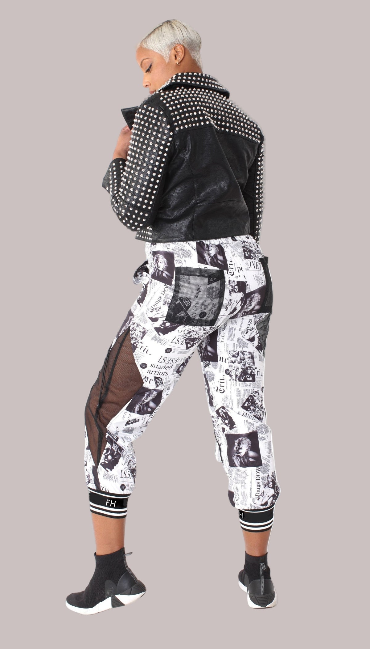 back view of printed mesh patchwork joggers showcasing mesh patch panels