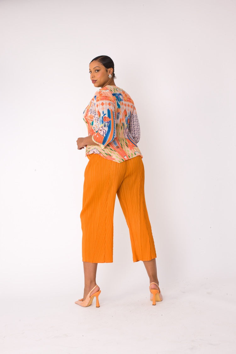 Model wearing the Printed Top and Palazzo Pants Set in orange multi, back view showing the top print and wide-leg palazzo fit, For Her NYC