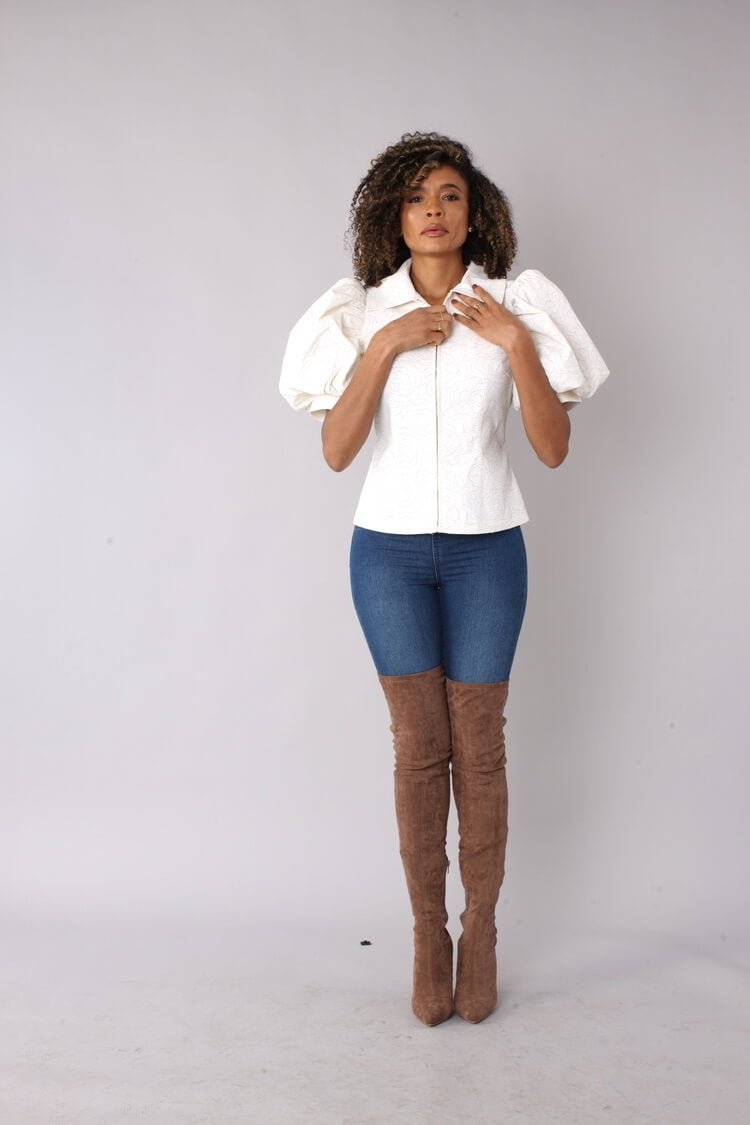 off White puff sleeve faux leather jacket front view with model lifting arms to showcase sleeve volume by For Her NYC