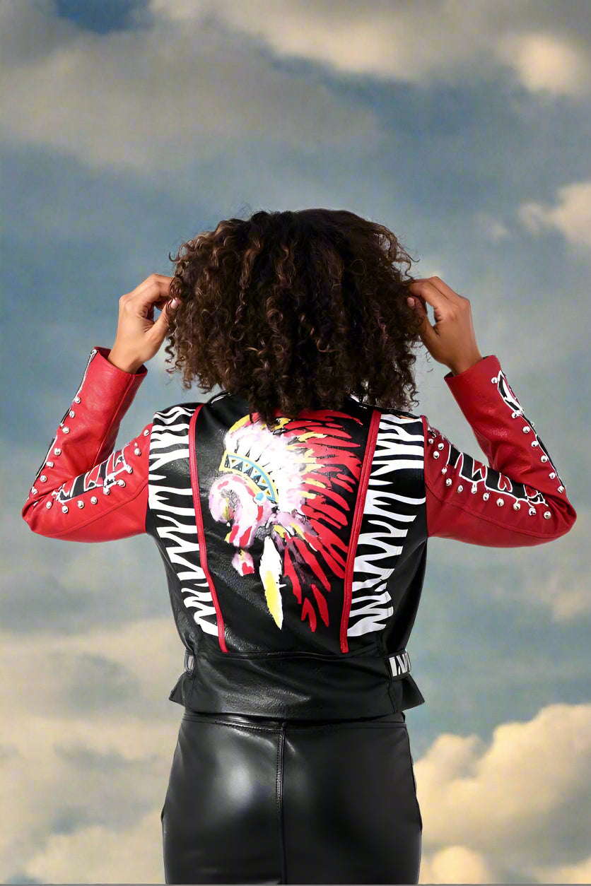 Back view of black and red punk style faux leather jacket showcasing bold zebra print and rocker edge.