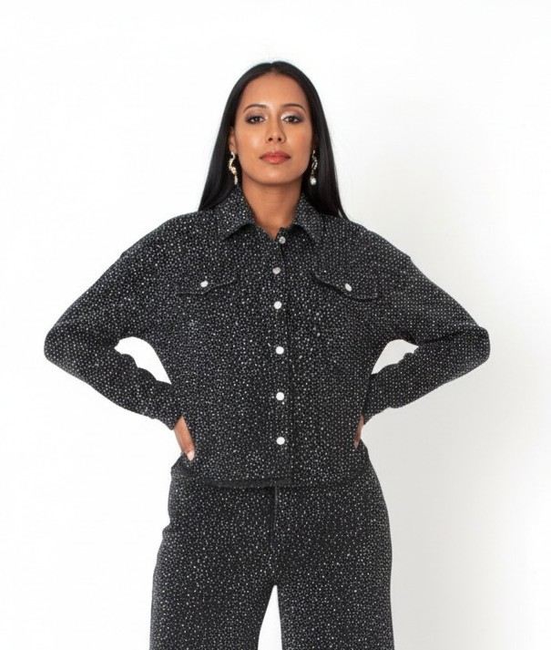 Front view of black rhinestone denim jacket and pants, hands on hips – For Her NYC