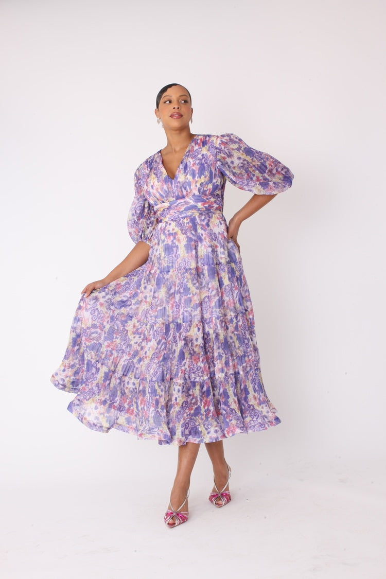 Purple multi tiered maxi dress showing movement and flow.