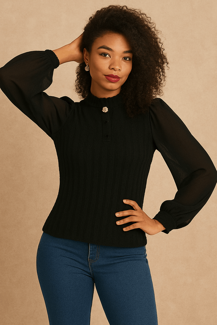 Black puff sleeve blouse styled with pants, full body standing view.