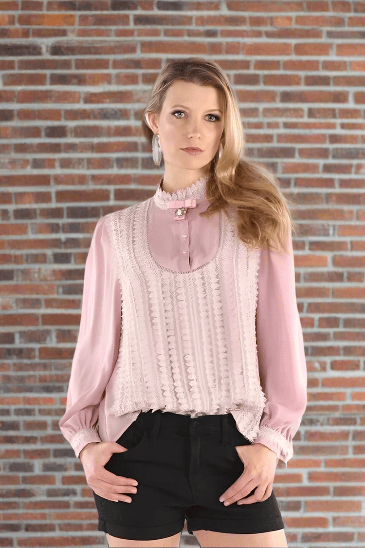 Pink puff sleeve blouse with ruffle neckline, full body standing view.