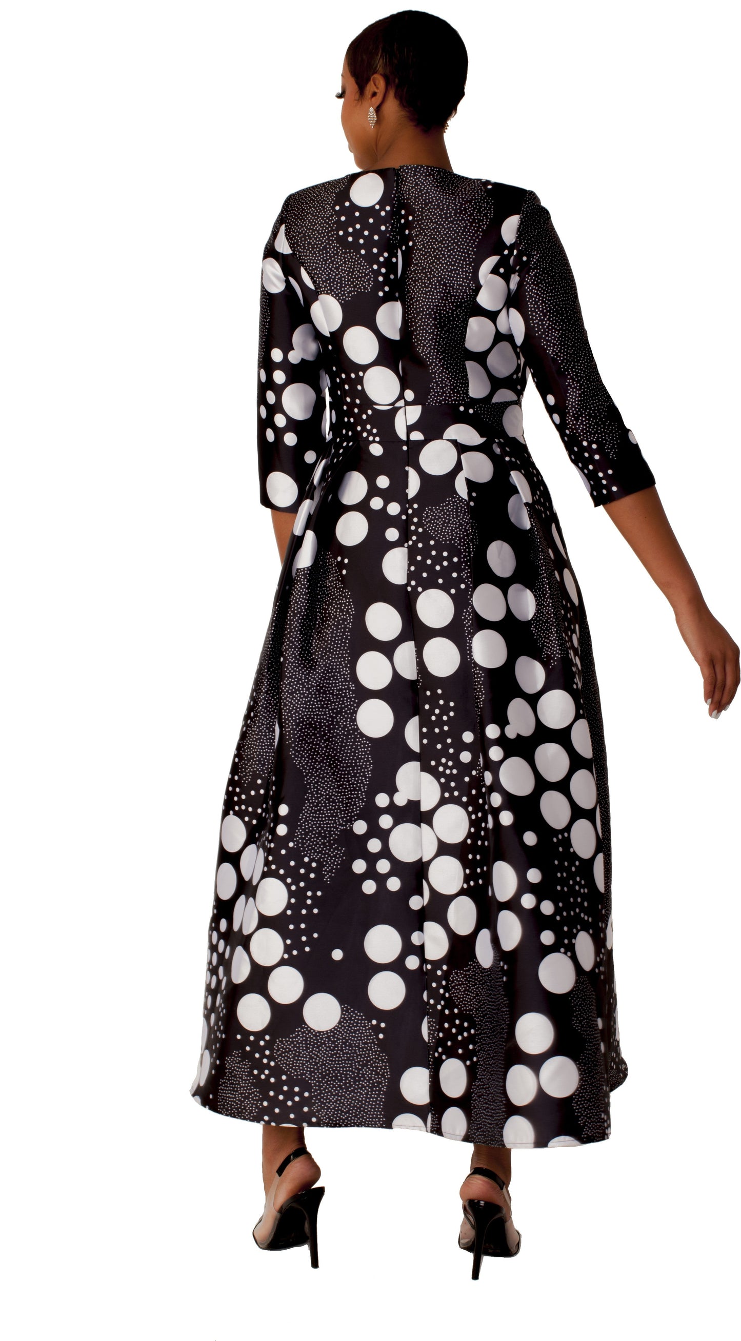 Black satin dress with silver swirl print and rhinestone brooch, model back pose showing full skirt – Tally Taylor
