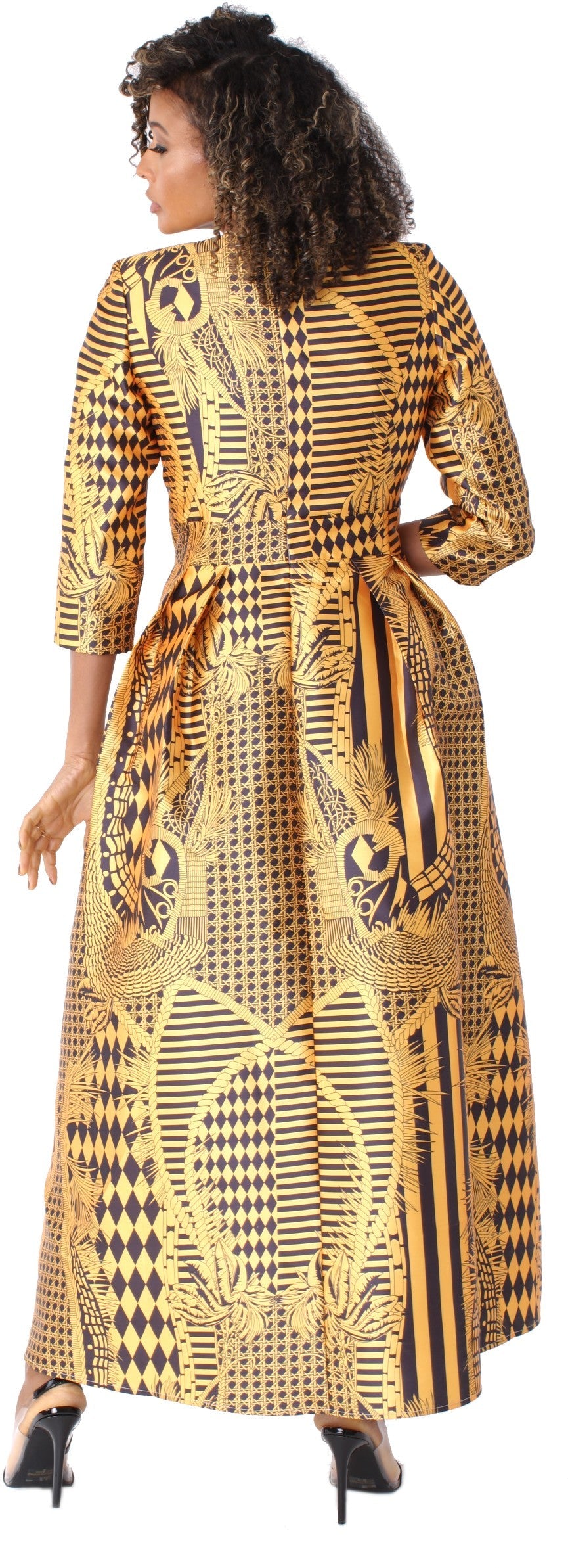Gold and black printed satin dress with rhinestone brooch, model side pose showing silhouette – Tally Taylor