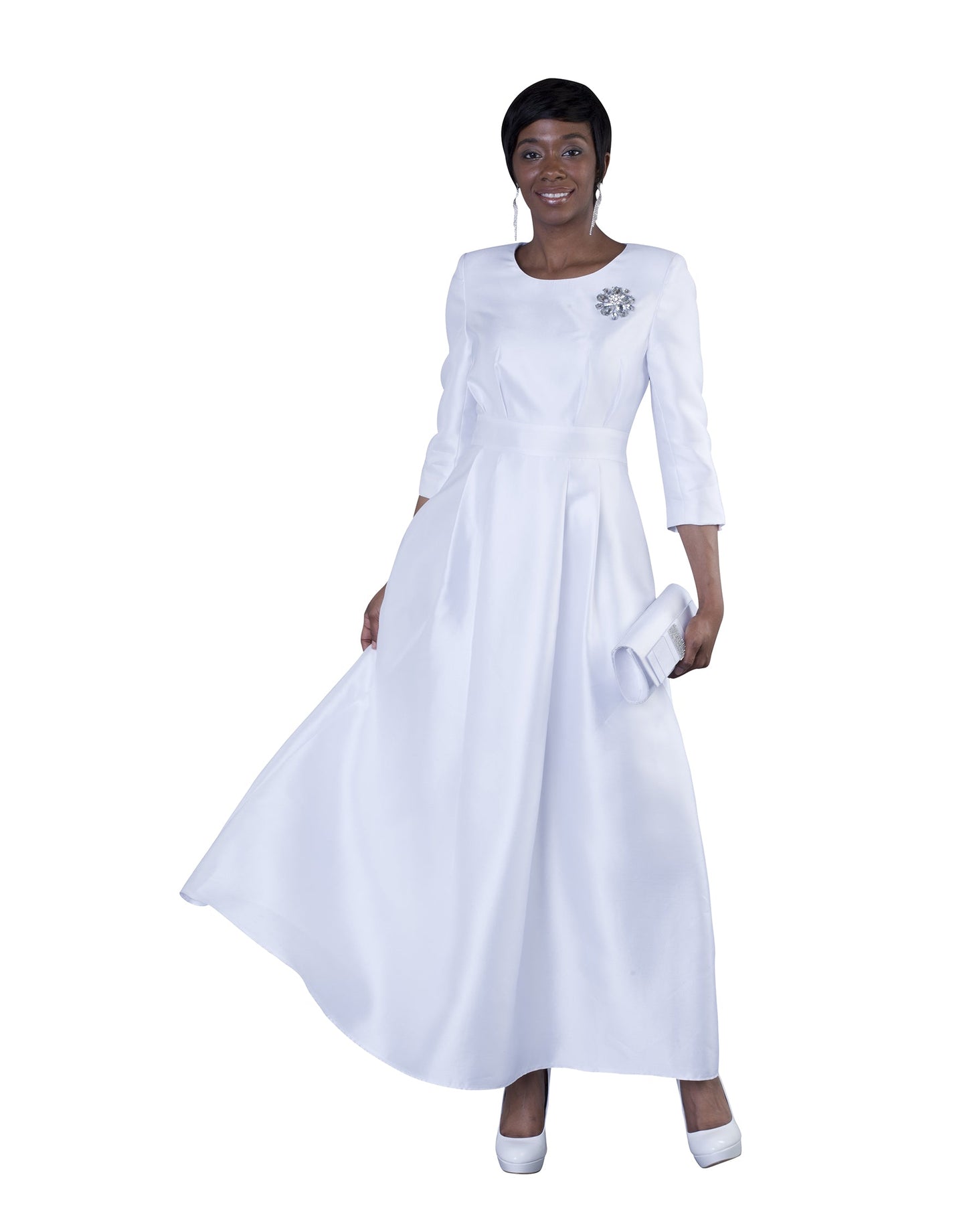 Light blue satin dress with rhinestone brooch and 3/4 sleeves, model standing front pose – Tally Taylor