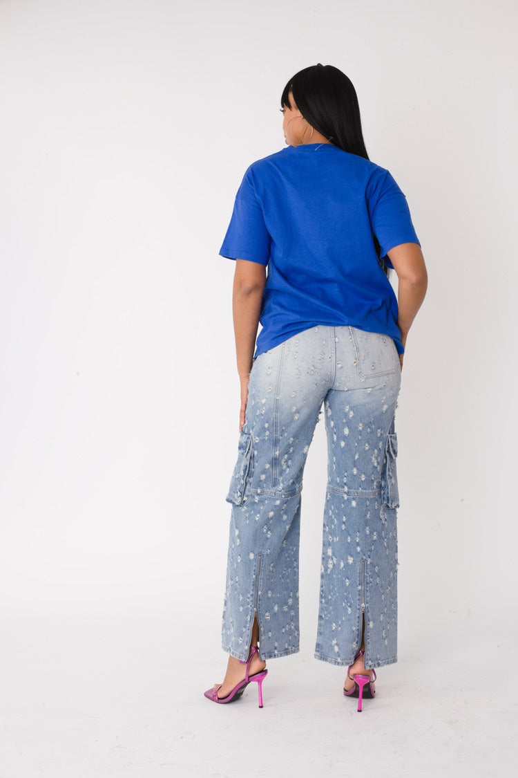 Royal multi street style graphic tee shown in back view highlighting length and relaxed silhouette, For Her NYC
