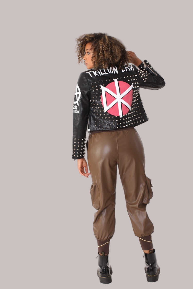 Back view of black studded leather jacket featuring Anarchy Is Freedom graphic and metal stud detailing, statement outerwear piece, For Her NYC